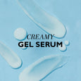 White creamy gel serum with droplets displayed on light blue background.