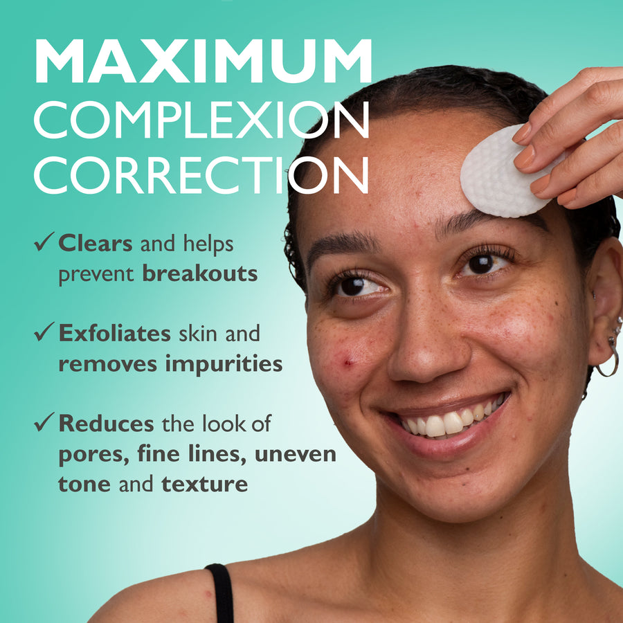 White complexion correction pad being applied to person's forehead against turquoise background.