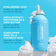 Blue bottle of Peter Thomas Roth Water Drench Whipped Cream Cleanser with white whipped cream texture swirls around it on bri