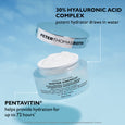Peter Thomas Roth Water Drench Hyaluronic Cloud Cream moisturizer jar with white cream and lid against blue background.
