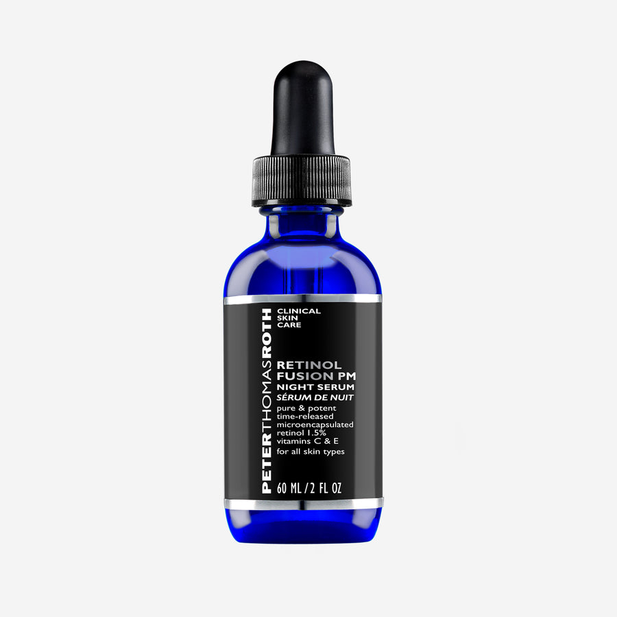 Dark blue glass bottle with black dropper cap and black label reading "Retinol Fusion PM Night Serum" by Peter Thomas Roth, 6