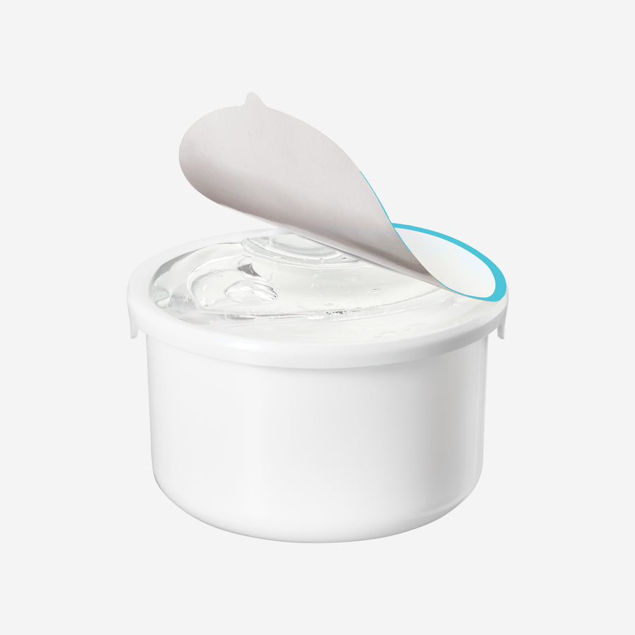 Clear gel moisturizer in white cylindrical refill pod with gray applicator and blue handle.