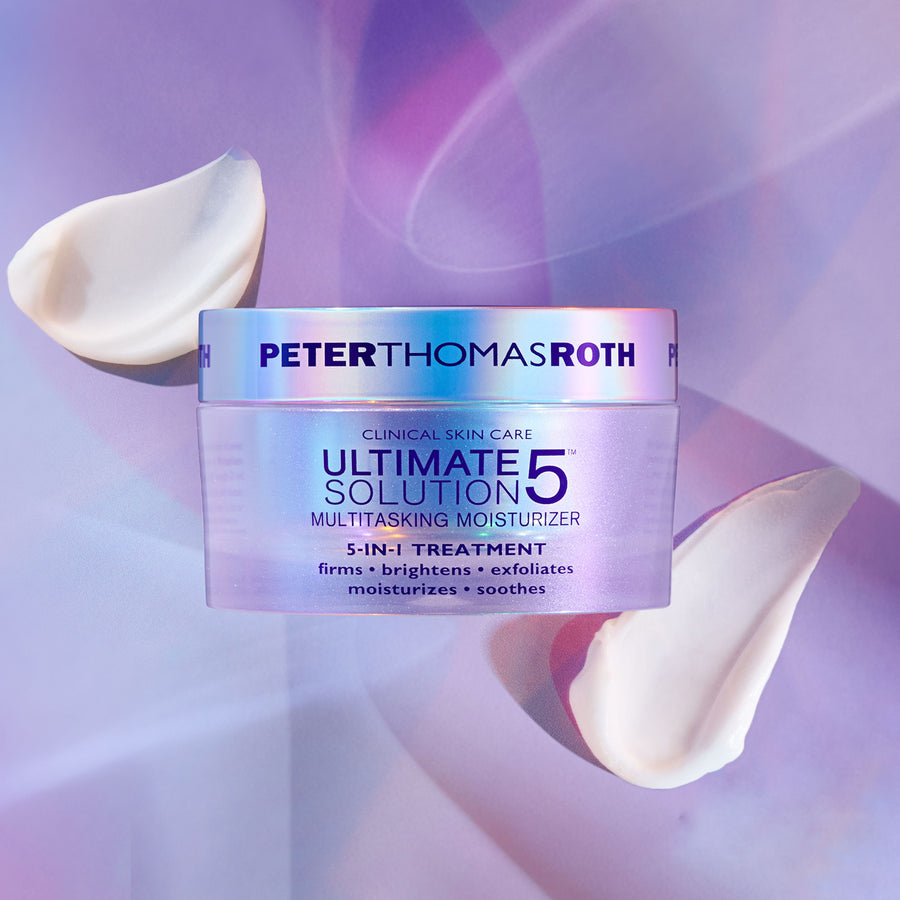 Peter Thomas Roth Ultimate Solution 5 Multitasking Moisturizer jar with white cream swatches on purple background.