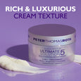 Peter Thomas Roth Ultimate Solution 5 Multitasking Moisturizer jar with white cream texture on purple background.