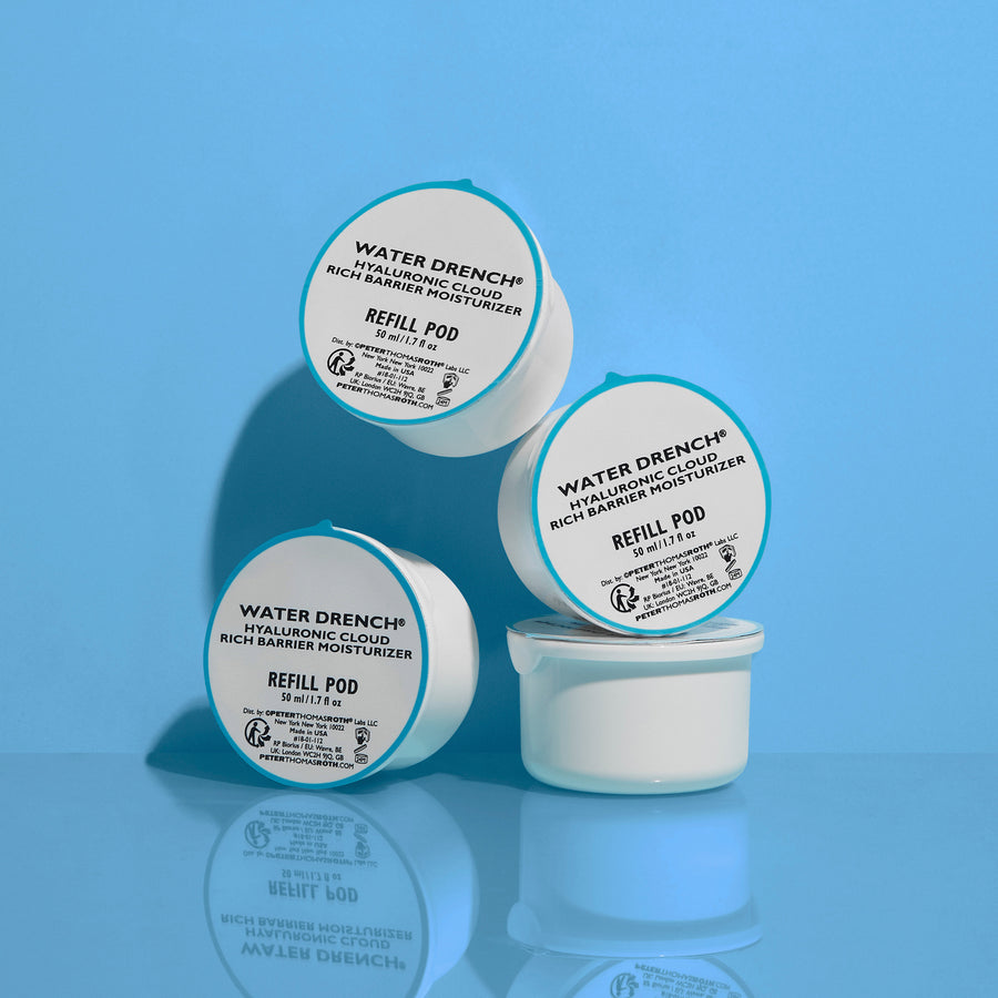 Four white refill pods with turquoise lids labeled Water Drench Hyaluronic Cloud Rich Barrier Moisturizer against a blue back
