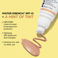 White tube with peach-toned tint dispensed in a swirl on yellow background, labeled Water Drench SPF 45.