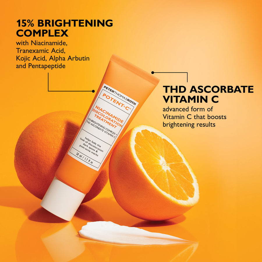 Orange tube of Potent-C Niacinamide Discoloration Treatment surrounded by fresh orange halves on yellow background.