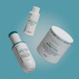 Three white skincare products labeled "Peptide Skinjection" on a blue background: a serum bottle, a liquid cleanser, and a ja