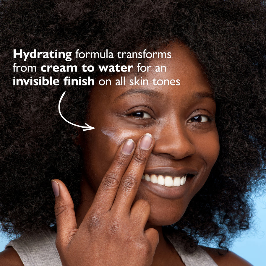 Light-textured moisturizer with SPF 45 sunscreen applied to person's cheek, showing sheer coverage on deep skin tone.