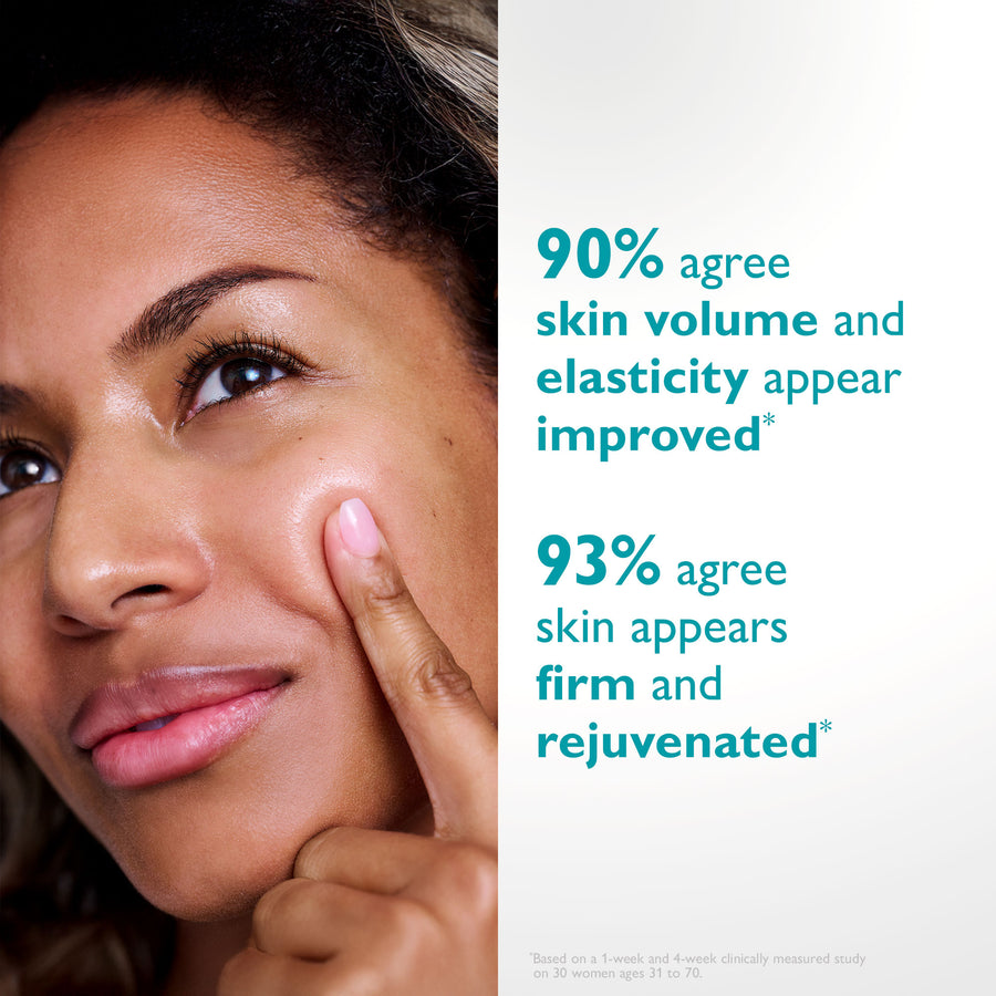 Person with medium skin tone touching cheek with finger, demonstrating product application on face.