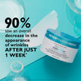 White moisturizing cream jar labeled "Peter Thomas Roth Peptide Skinjection" on turquoise background with glass containers.