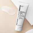 White tube of Peter Thomas Roth Mega-Rich Nourishing Body Lotion with product swatch on beige background.