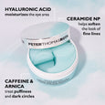 Open jar of Peter Thomas Roth eye patches with three turquoise gel patches visible inside and white lid.
