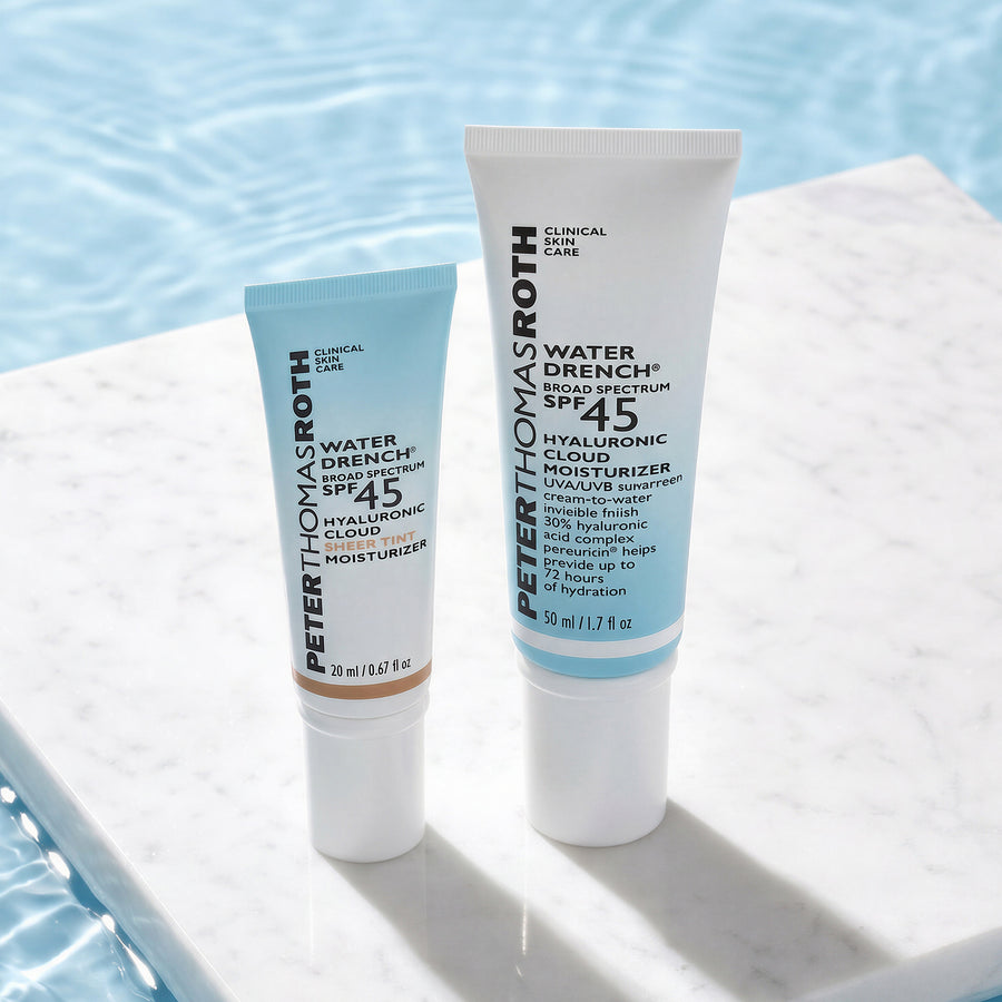 Two Peter Thomas Roth Water Drench sunscreen moisturizers with SPF 45 in different sizes displayed poolside.