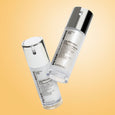 Two white bottles of Peter Thomas Roth Un-Wrinkle Eye Concentrate with white caps on a yellow background.