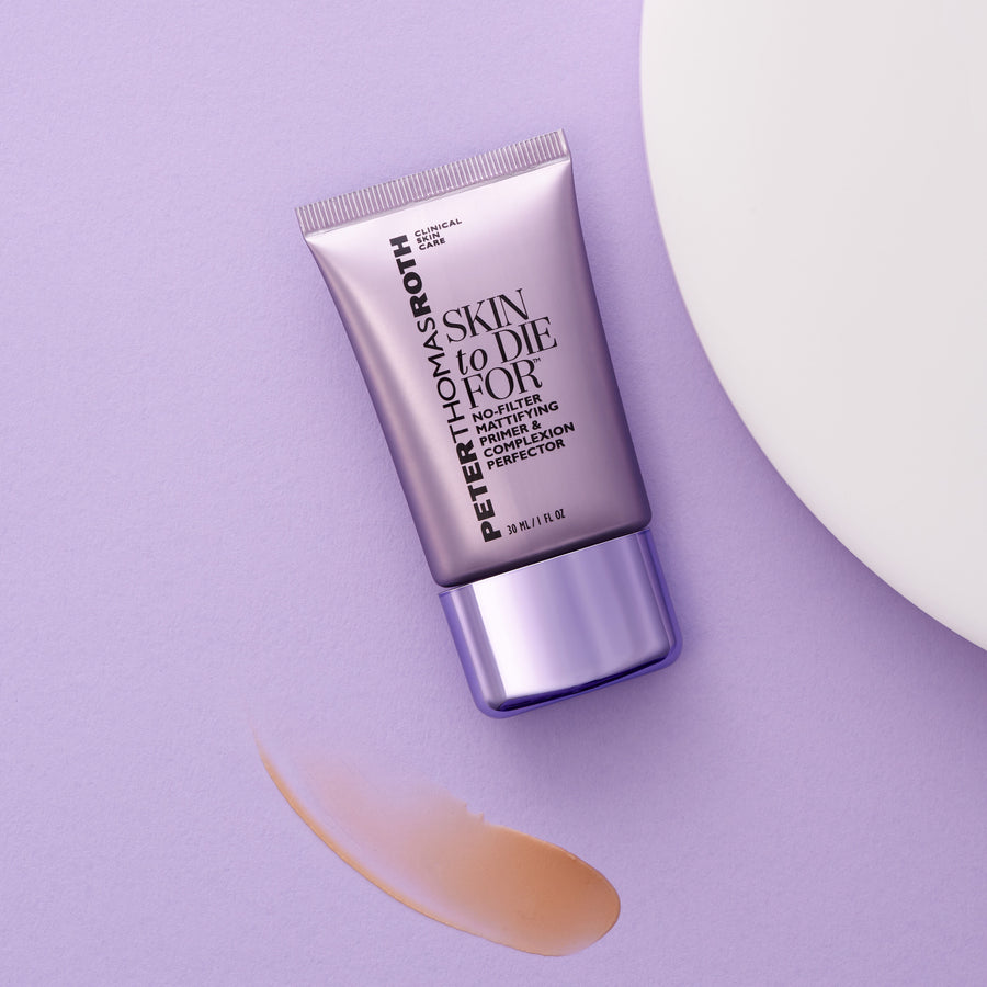 Peter Thomas Roth mattifying primer in a white tube with lavender cap on purple background with product swatch.